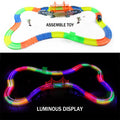 Magic Tracks with 9Ft Flexible Glow Racing Tracks 220Pcs and Light up Racing Polic Car