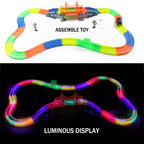 Magic Tracks with 9Ft Flexible Glow Racing Tracks 220Pcs and Light up Racing Polic Car